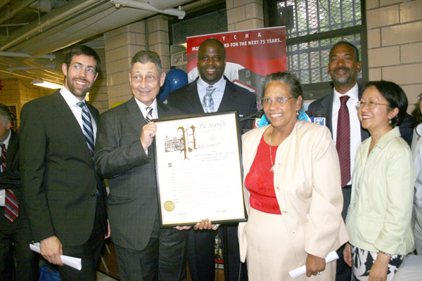 Back in 2011 before Hurricane Sandy, Smith Houses Tenant Association President Aixa Torres (in white) received an award for helping lead evacuation efforts for Hurricane Irene, which ended up not hitting N.Y.C. hard.  With her was State Sen. Daniel Squadron, N.Y.S. Assembly Speaker Sheldon Silver, N.Y.C.H.A. Chairman John Rhea and City Councilmember Margaret Chin.  Downtown Express file photo by Aline Reynolds 