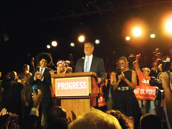 Downtown Express photo by Duncan Osborne Bill de Blasio flanked by his son, Dante, his daughter Chiara, and his wife, Chirlane McCray.