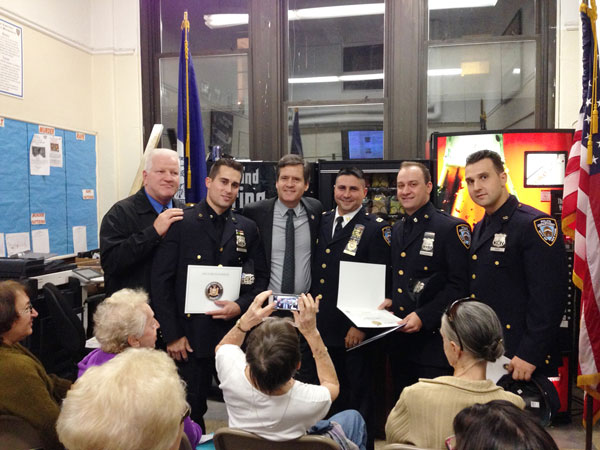 Photo by Jared Chausow State Senator Brad Hoylman presents Cop of the Month winners (second, fifth and sixth from left) with a citation.