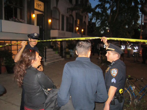 Photo by Lincoln Anderson Officers let residents of 188 Sixth Ave. back across the police line so they could listen to city officials tell them if they could re-enter their homes.