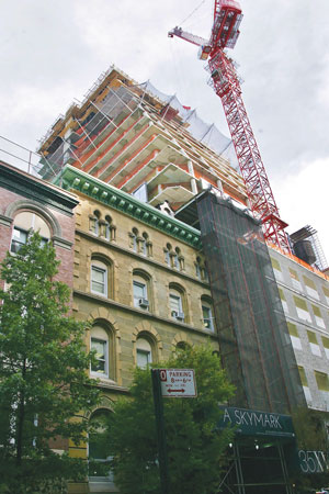 Photo by Sam Spokony Neighbors say Alchemy’s after hours construction on its 35 W. 15th St. luxury building is bad mojo.