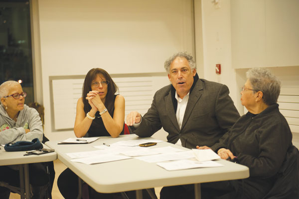 Downtown Express file photo by Terese Loeb Kreuzer Bob Townley, center, a Community Board 1 member and the leader of Manhattan Youth, spoke about the importance of the Stuyvesant Community Center at a board meeting last month. 