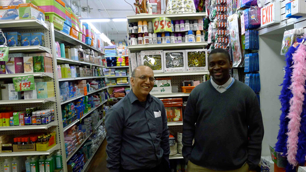 Photo by Heather Dubin Back in business: 99 Cents Creation owner Afsar Khan, left, and General Manager Mamdou Diaman. 