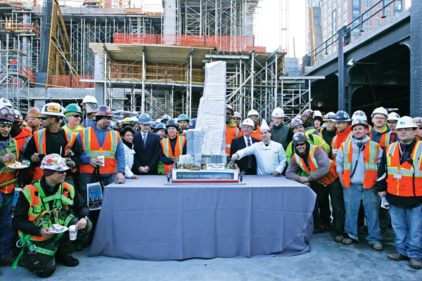 Photo by Sam Spokony Hudson Yards construction workers joined executives from Related and Fairway Market around the cake modeled after 10 Hudson Yards.