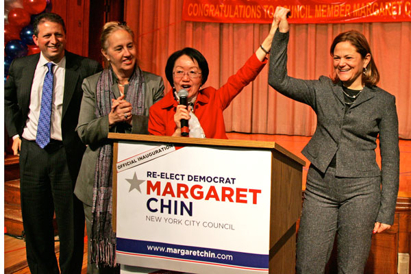 Downtown Express photo by Sam Spokony. Councilmember Chin raised her hand with Councilmember Melissa Mark-Viverito, right, at Chin’s swearing in ceremony Jan. 5. At left is Councilmember Brad Lander and Borough President Gale Brewer. 