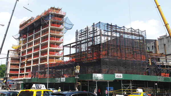 Downtown Express photo Works in progress: One Vandam, left, and the God’s Love We Deliver building, right.