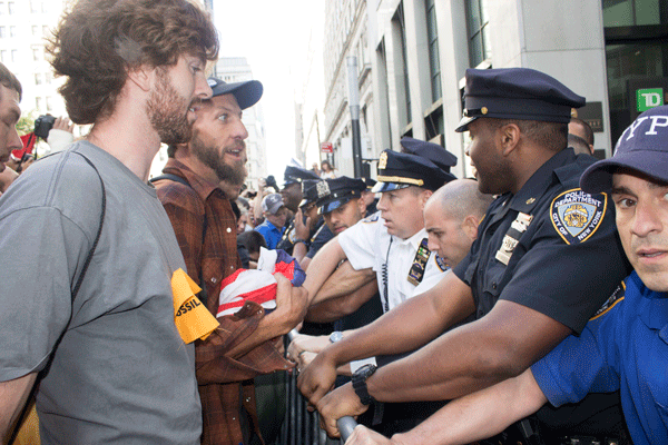 Downtown Express photos by Zach Williams  About 100 environmentalist demonstrators were arrested Downtown Monday, the day after the larger climate change rally in Midtown. 