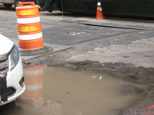 Downtown Express photos by Dusica Sue Malesevic Tribeca’s N. Moore St. has not seen its historic cobblestones for many years.