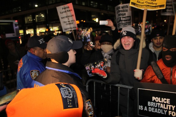 Demonstrators against police brutality at City Hall Dec. 19. Downtown Express photo by Zach Williams. 