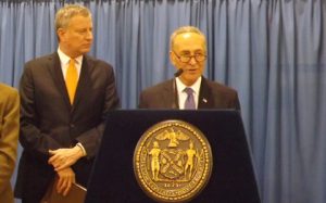 Mayor de Blasio and Sen. Schumer in Red Hook March 31 announcing $3 billion in funds for NYCHA complexes around the city. Downtown Express photo by Duncan Osborne.