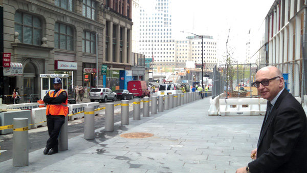 Downtown Express photos by Josh Rogers The Port Authority’s Steve Plate, just before he opened the Liberty St. sidewalk for pedestrians.