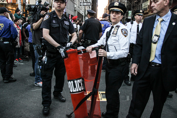 As #BlackLivesMatter protesters got ready to march out of Union Square on Wed., April 29, Inspector Elisa Cokkinos was ready to unfurl an orange net to corral them if they swarmed into the street. Beforehand, police had given strict warnings to the protesters to stay on the sidewalks or face arrest. The large orange nets were first seen during the 2004 Republican National Convention, when New York City police used them to make mass arrests of protesters.   Photos by Tequila Minsky