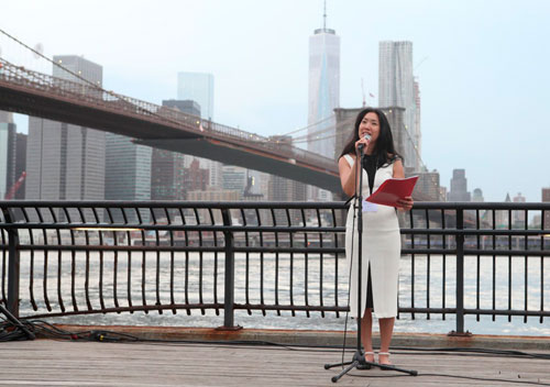 Brooklyn Poet Laureate Tina Chang reads aloud at the 20th annual Poetry Walk Across the Brooklyn Bridge. Photo by Jason Speakman/Courtesy of The Brooklyn Paper.