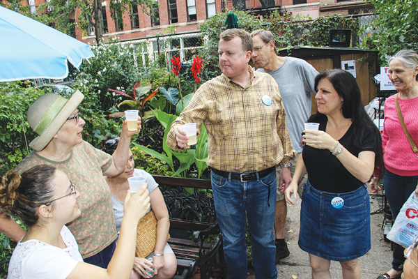 Victory Toast  |  Dennis Gault and Terri Cude, right, the new Democratic district leaders of Part B of the 66th Assembly District, toasted their victory Sept. 13 in the LaGuardia Corner gardens.  Gault, a Battery Park City resident, and Cude from the Village each got about 68 percent of the vote Sept. 10, defeating incumbents John Scott and Jean Grillo. There’s been a kerfuffle over mailings sent by Downtown Independent Democrats criticizing Scott and Grillo, but for his part Scott, who also criticized the campaign literature, wrote in a letter to Downtown Express (P. 18) that he didn’t think the mailings affected the result.    Downtown Express photo by Tequila Minksy 