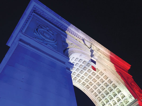 Photo by Tequila Minsky The Washington Square Arch was lit in the colors of the French flag on Saturday evening.