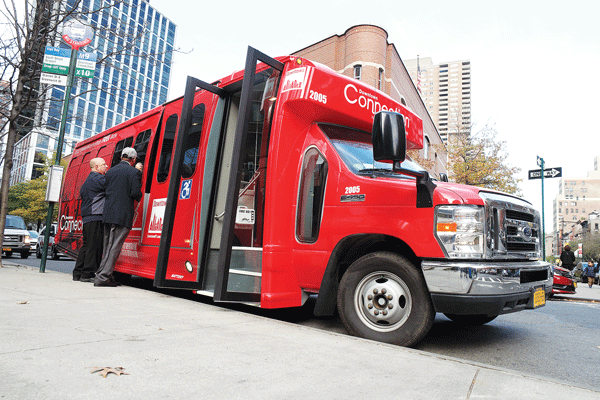 Downtown Express photo by Milo Hess The Downtown Alliance unveiled its snazzy new shuttle buses over the weekend.