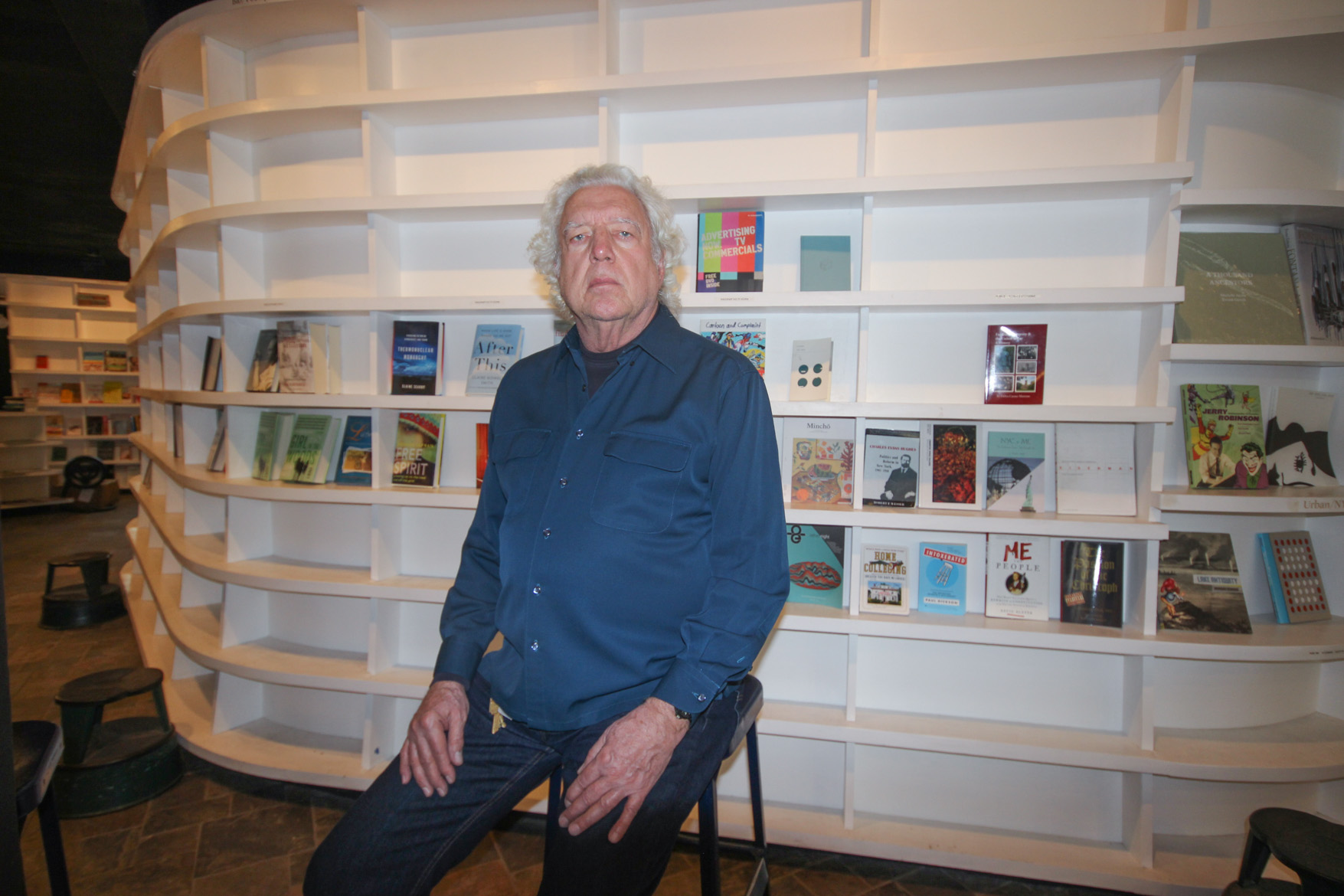 St. Mark’s Bookshop owner Bob Contant this past Tuesday in front of mostly barren shelves at the E. Third St. store. The store is holding a 50 percent clearance sale. Asked by the photographer if he had any “parting words,” he paused for a second, chuckled and said, “To books and reading.”  Photo by Tequila Minsky 