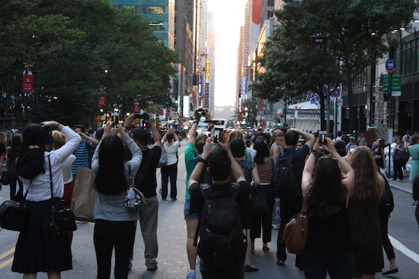 Manhattanhenge fans capture 42nd Street on June 12 to capture the magic moment of sunset. | MICHAEL SHIREY 