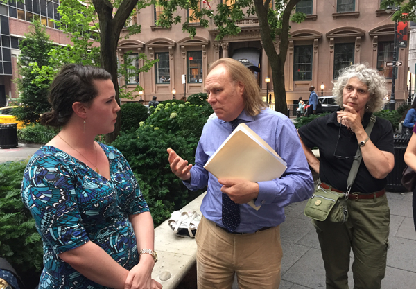 Photo by Yannic Rack Roxanne Earley, Councilmember Margaret Chin's land-use director, at left, discusses the Water St. text amendment with Community Board 1 member Roger Byrom, center.