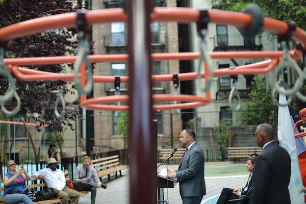 Councilmember Corey Johnson delivers remarks at the June 29 ribbon-cutting ceremony. To his left, standing, is NYC Parks Dept. Commissioner Mitchell Silver, with State Senator Brad Hoylman (seated). Photo by William Alatriste/NYC City Council. 