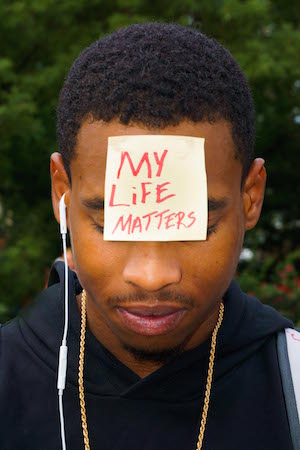 A young man in Union Square on Sun., July 10. Photo by Daniel Kwak. 