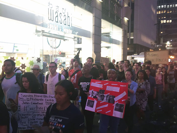 Protestors marched up Seventh Ave. near Times Square, before heading east to Grand Central. Photo by Lauren Vespoli.