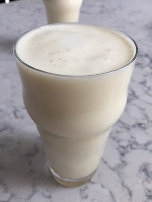 A homemade frozen coconut margarita made with real coconut milk is much better than a sugar-laden purée you often find at bars. Photo by Carlye Husserl.