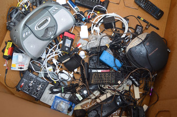 Cables and other gadgets stored in a box at the LESEC’s e-waste collection event. Photo by Alex Ellefson.