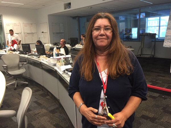 Volunteer Lilliam Rivera-Cruz in the call center of the American Red Cross’ Greater NY office, recently opened in Hell’s Kitchen with the objective of fielding emergency calls coming in as a result of the disaster in Louisiana. Photo courtesy American Red Cross.