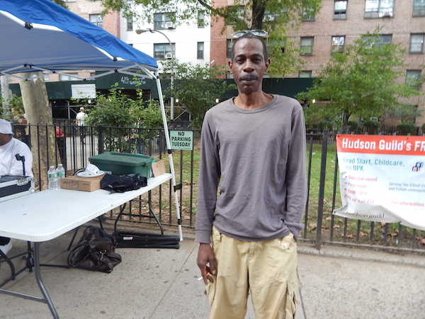 Fulton Houses’ Barry Wilson stands by the DJ Booth set up on W. 17th St. Photo by Jane Argodale.