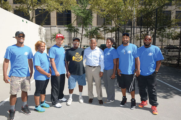 Parks Commissioner Mitchell J. Silver (in dress shirt), with members of the St. Albans Handball Association. Photo by Malcolm Pinckney, courtesy NYC Parks.