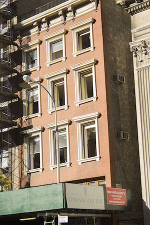 The explosion blew out the front windows of the Townhouse Inn (above the King David Gallery), but the hotel has repaired them and re-opened on Oct. 1. Photo by Naeisha Rose.