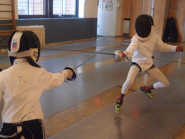 A duel during summer day camp at Fencers Club. Photo courtesy Fencers Club.