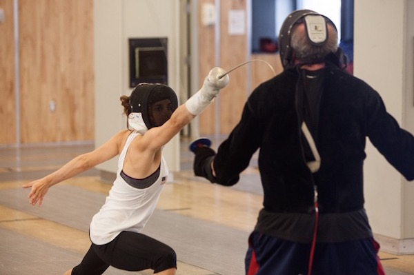 Nicole Ross, a 2012 Olympian, takes a lesson from her coach Simon Gershon. Photo courtesy Fencers Club.