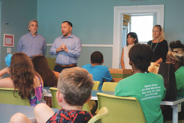 Councilmember Corey Johnson, second from left, speaks to Hartley House summer camp children. Courtesy Office of Councilmember Corey Johnson.