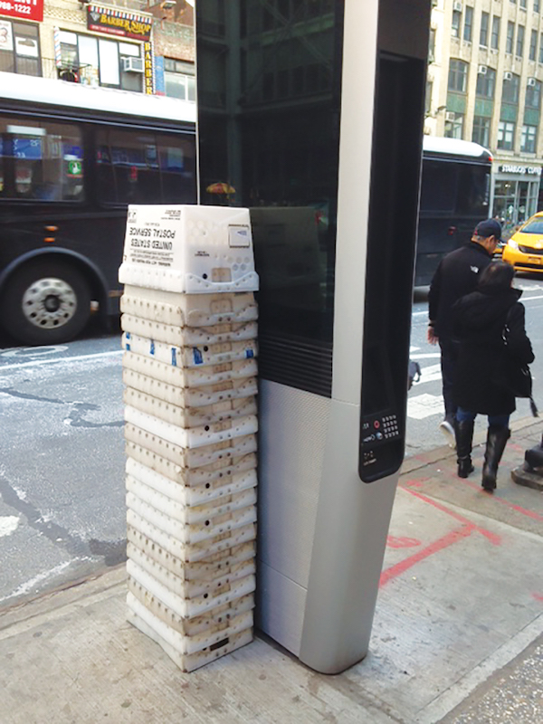 John A. Mudd of the Midtown South Community Council said people were stacking up USPS crates to use them as chairs, as seen here at W. 40th St. & Eighth Ave. Photo by John A. Mudd.