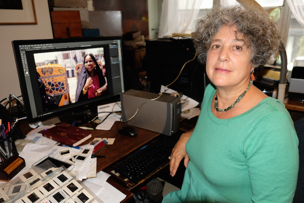 Schreibman with her photograph of a woman in Pakistan. Photo by Tequila Minsky.