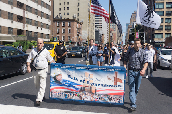 The Walk of Remembrance makes its way down Seventh Ave. Photo by Daniel Kwak.