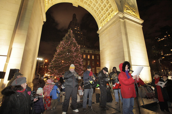 You lend your voice, and the Rob Susman Brass Quartet will give the gift of music — at Dec. 7 & 24 events beneath the Washington Square Park Arch. Photo by Ken Howard.