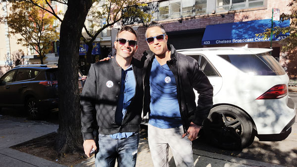 L to R: Taz Pereira, 33, and Eran Amir, 39, said they chose Clinton for her experience and qualifications. Photo by Dusica Sue Malesevic.