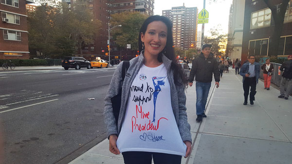 Vanessa Pestritto, 31, a Chelsea resident since 2010, shows off her Diane Von Furstenberg shirt that touted “Proud to support Mme. President.” Photo by Dusica Sue Malesevic.