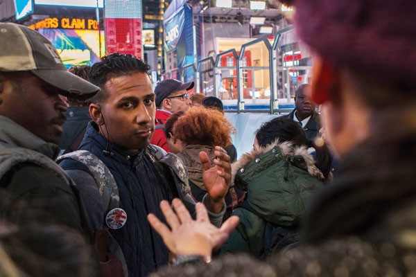 Harlem resident and Trump supporter Hugo Lantigua engages in a heated discussion with a Hillary Clinton supporter on Tuesday night before the outcome of the election was clear. Photo by Zach Williams.