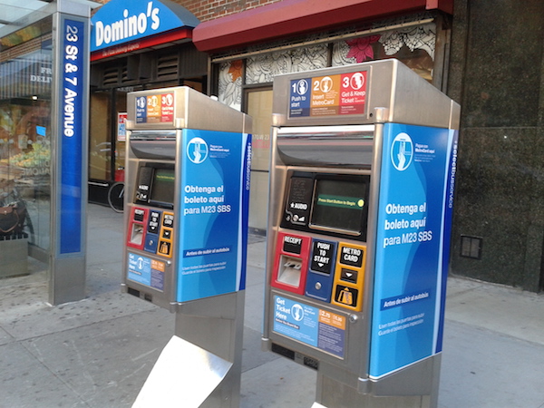 SBS riders buy their tickets before boarding using machines similar to MetroCard vending machines found at subway stations. Photo by Scott Stiffler.