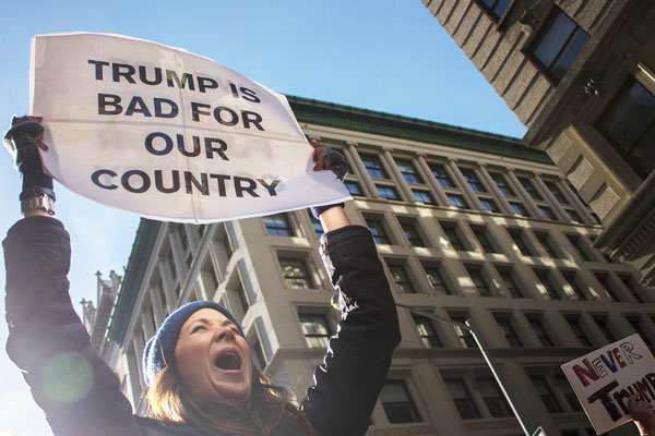 Sign of a whole new time: A participant in the Nov. 12 demonstration that went from Union Square to Trump Tower. Photo by Zach Williams.