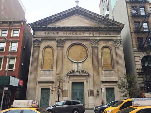 The St. Vincent de Paul Church has been closed since 2013. Its stained glass windows were damaged in the Sept. 17 Chelsea bombing. Photo by Dennis Lynch.