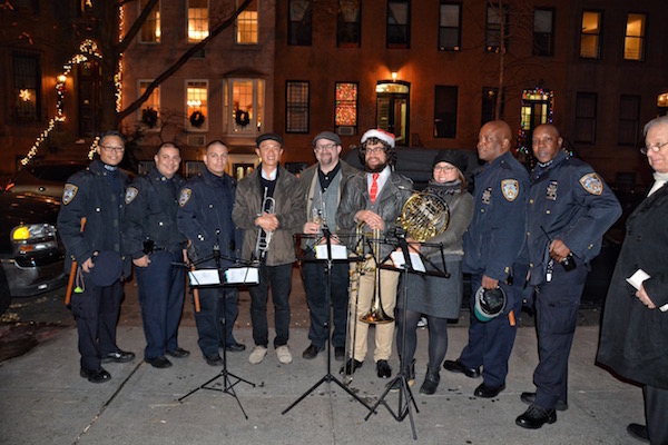 On Dec. 15, neighborhood caroling gets a boost of brass, courtesy of the Chelsea Symphony. Photo by Pat Cook.