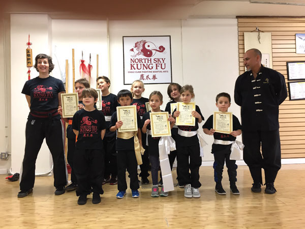 North Sky Kung Fu students show their new sashes and certificates after a recent test. Kicks, strikes, and self-defense techniques were required. Photo courtesy NSKF.