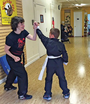 Sifu Julie works with a student on blocking and self-defense. Photo courtesy NSKF.