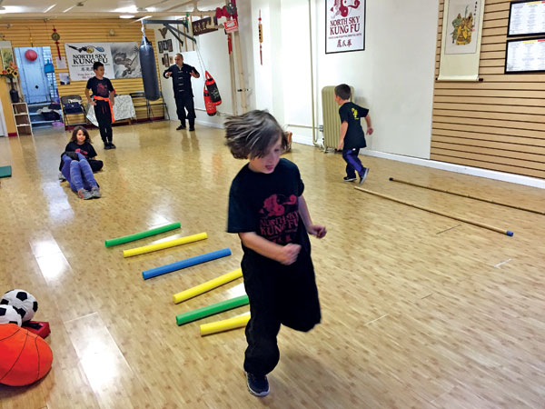 Young martial artists race through an obstacle course, one of their favorite challenges. Photo courtesy NSKF.