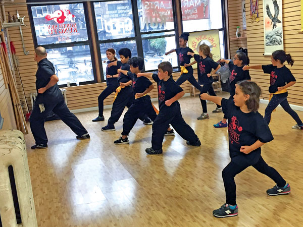 Kids practice Kung Lek Kuen (Power Fist Form) with Sifu Dario. Photo courtesy NSKF.